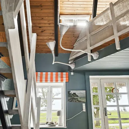 By The Bay A Thatched House Lies So Beautifully