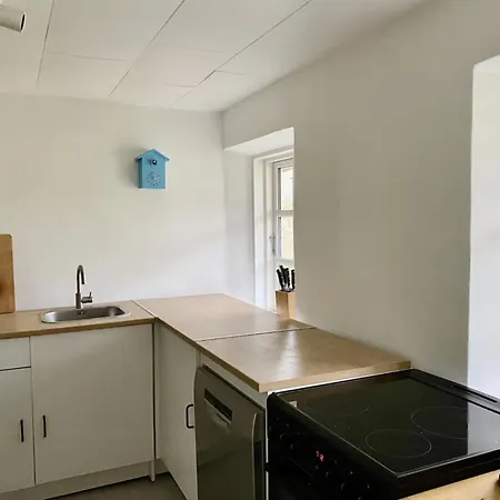 By The Bay A Thatched House Lies So Beautifully