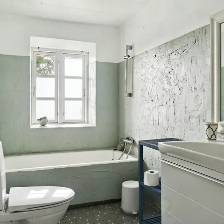 By The Bay A Thatched House Lies So Beautifully